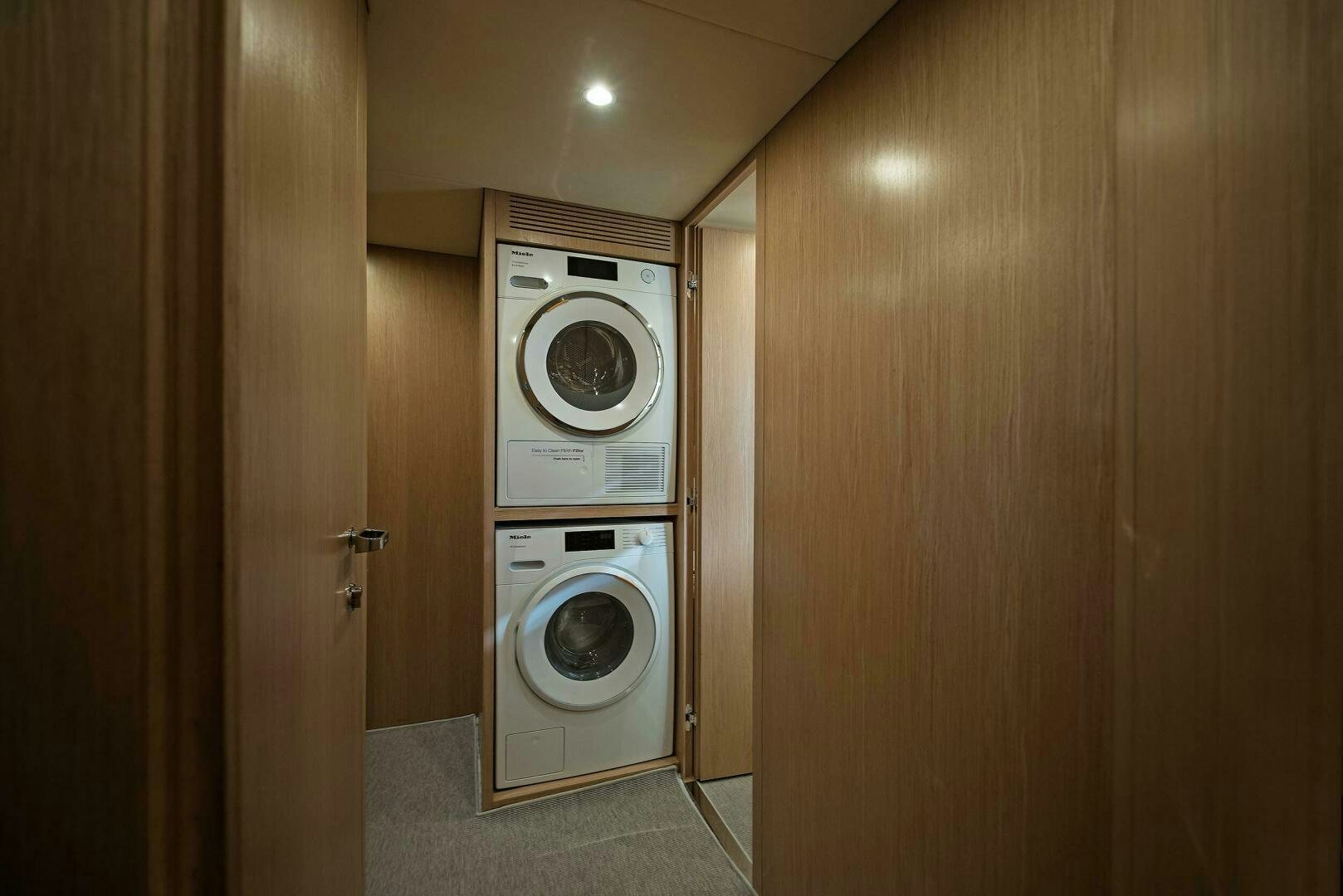 a washer and dryer in a room aboard ALEGRA Yacht for Sale
