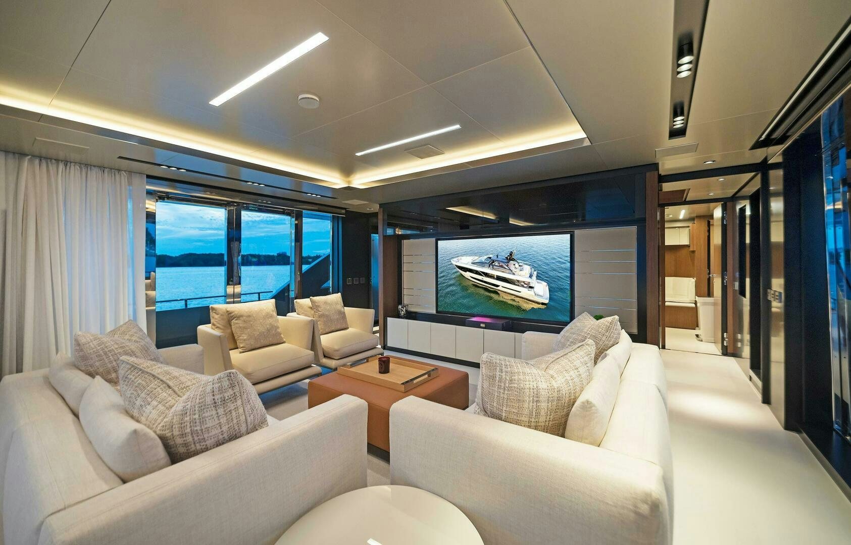 a living room with a large screen aboard ALEGRA Yacht for Sale