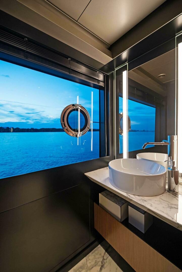 a bathroom with a large window aboard ALEGRA Yacht for Sale