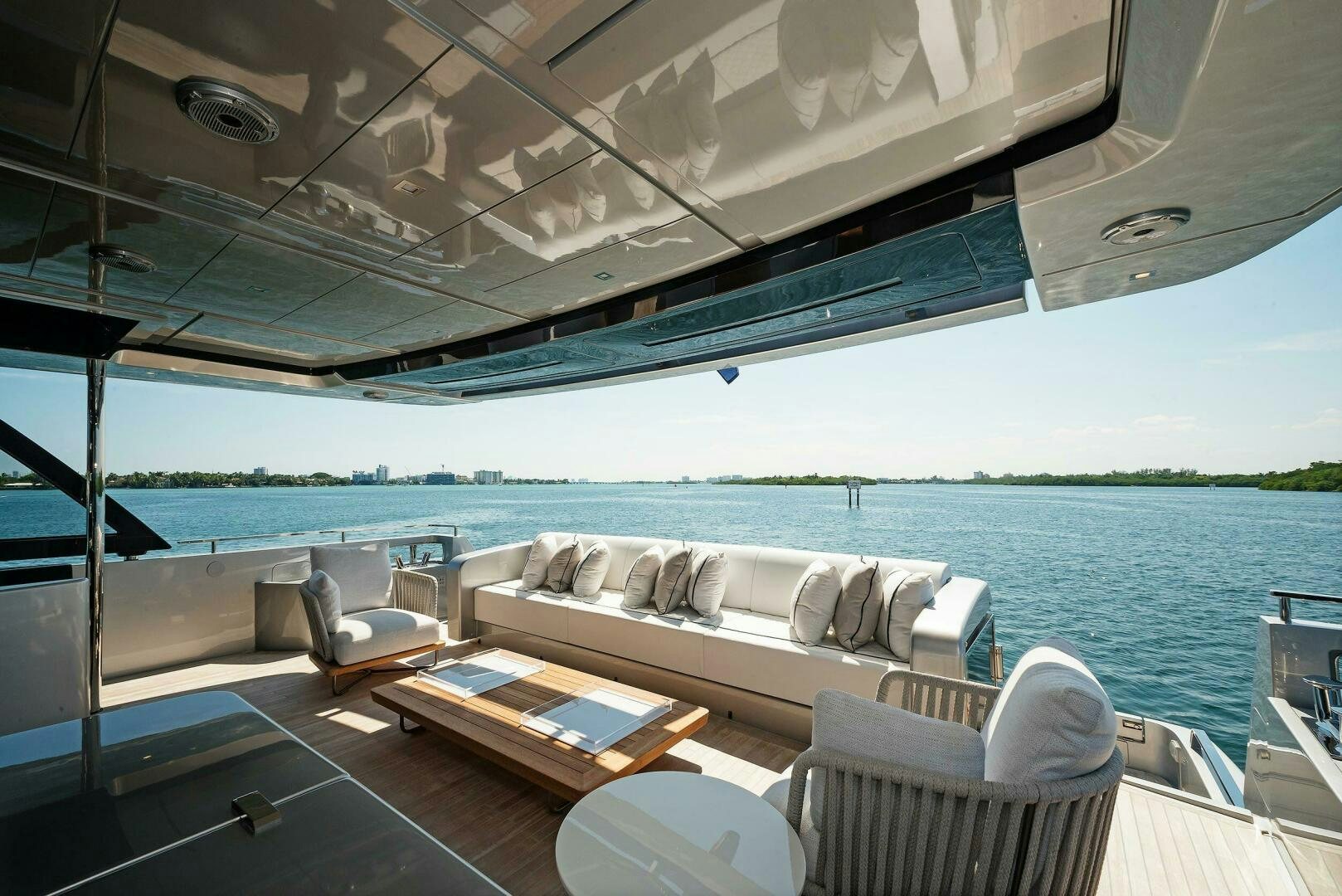 a large living room with a large balcony overlooking a body of water aboard ALEGRA Yacht for Sale