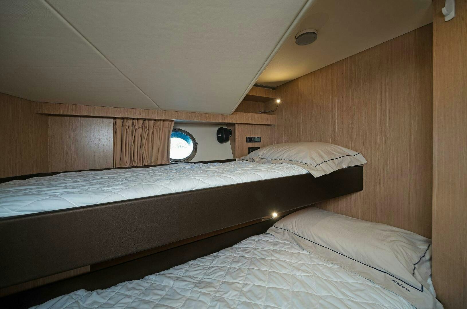 a room with two beds aboard ALEGRA Yacht for Sale