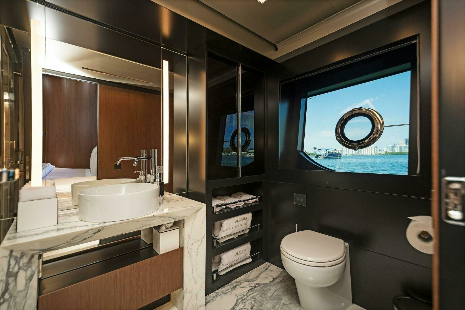 a bathroom with a sink toilet and a mirror aboard ALEGRA Yacht for Sale
