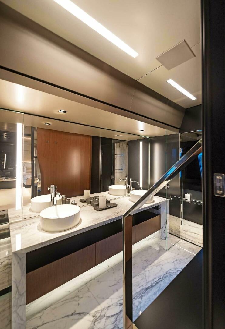 a bathroom with a large mirror aboard ALEGRA Yacht for Sale