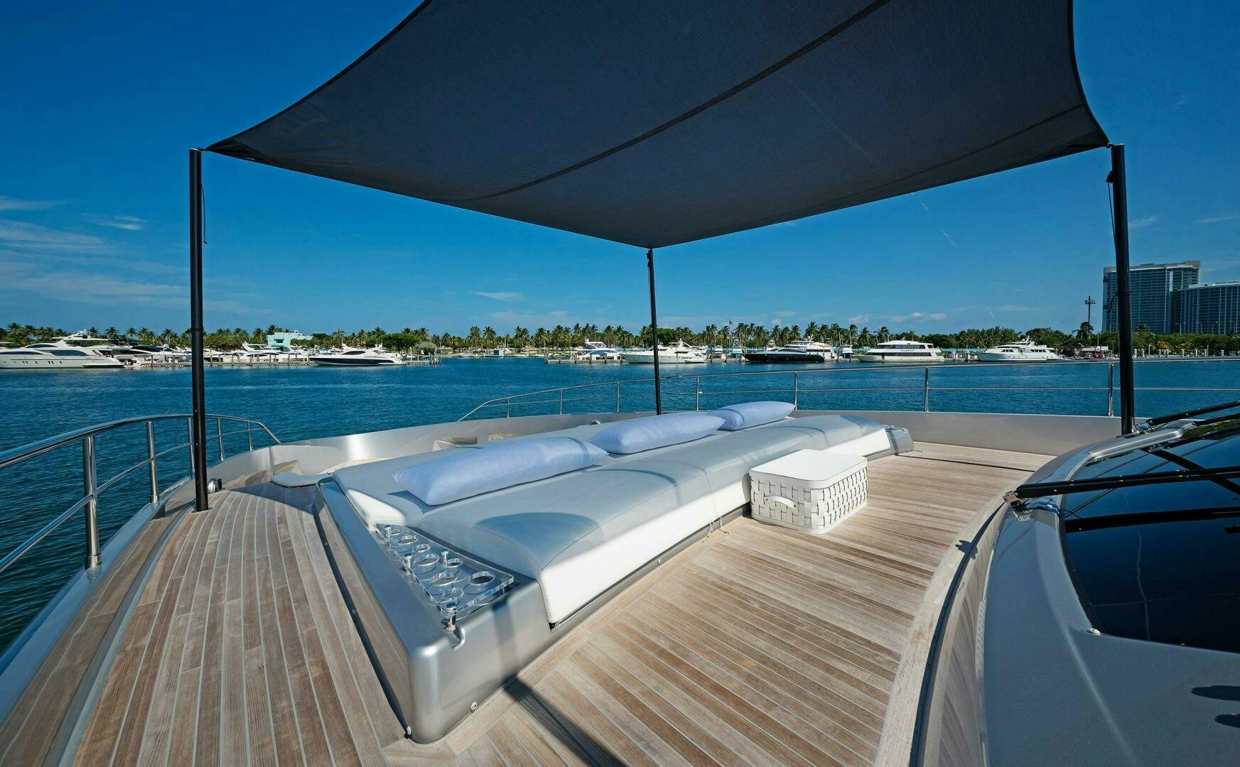 a deck with a large body of water and a large boat on it aboard ALEGRA Yacht for Sale