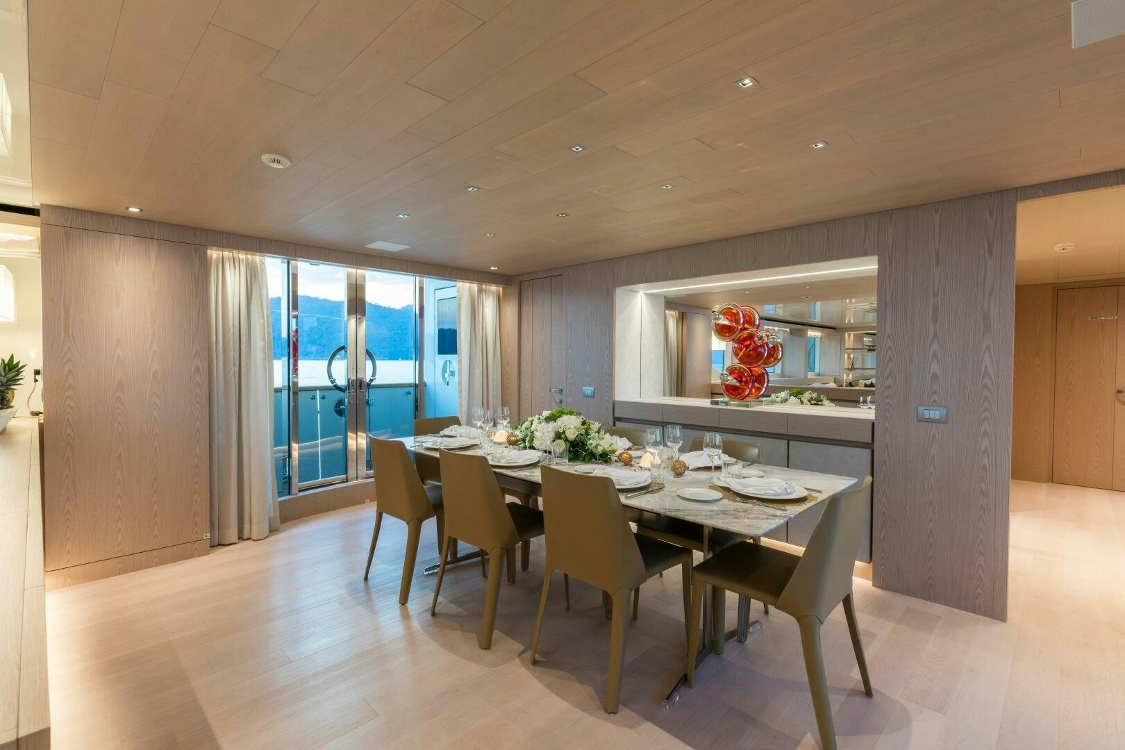 a large kitchen with a dining table aboard GLORY Yacht for Sale