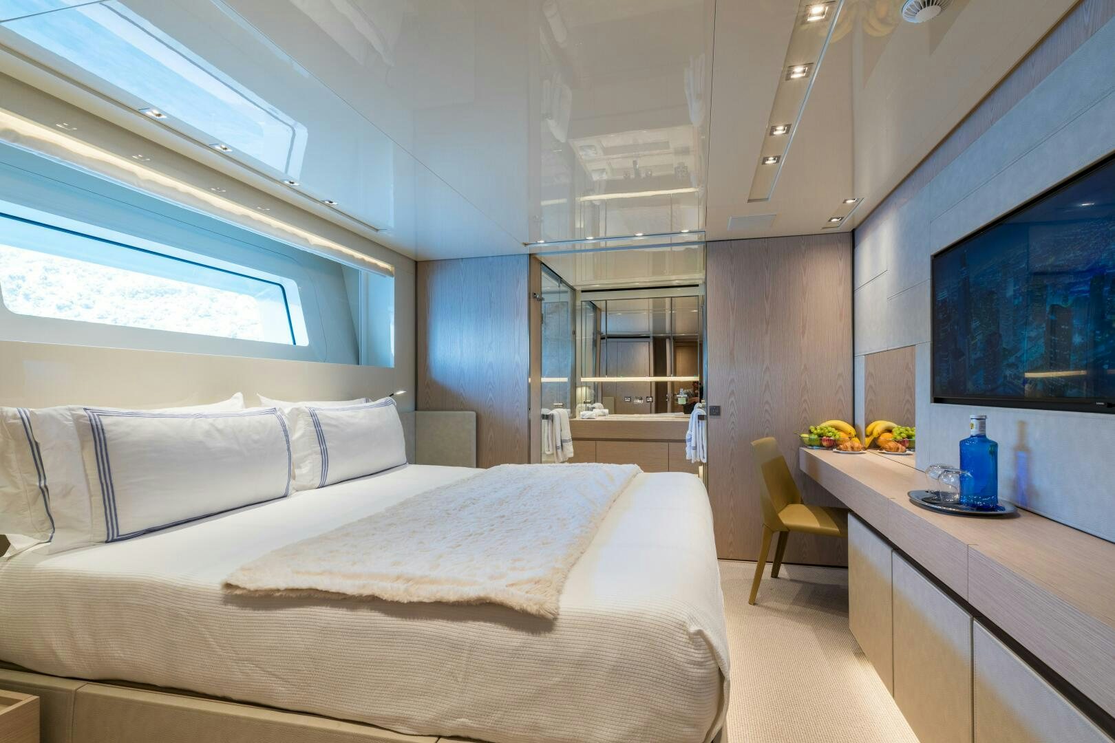 a room with a bed and a desk aboard GLORY Yacht for Sale