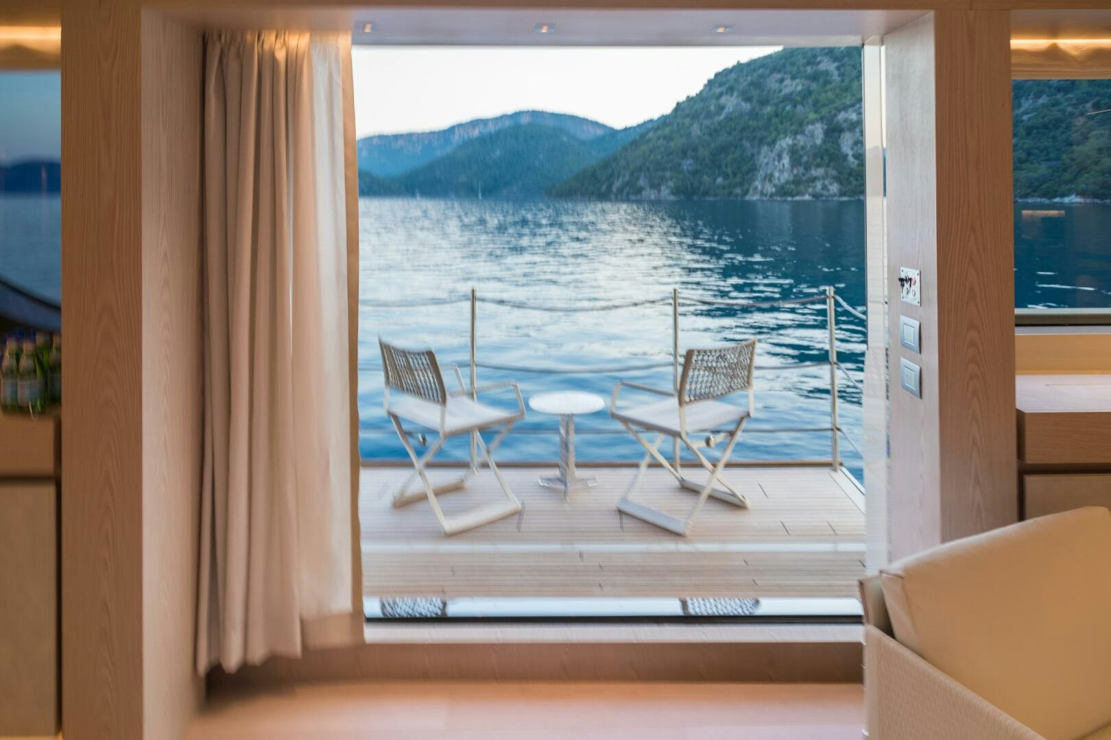 a room with a table and chairs aboard GLORY Yacht for Sale