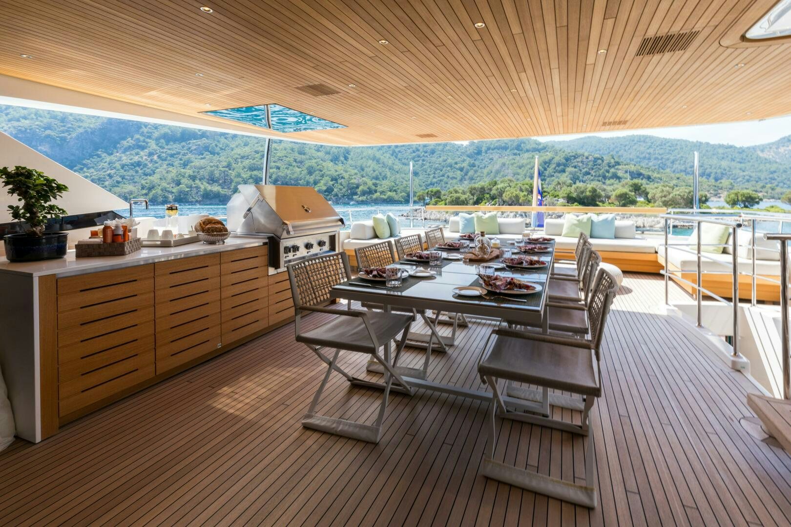 a room with a table and chairs aboard GLORY Yacht for Sale