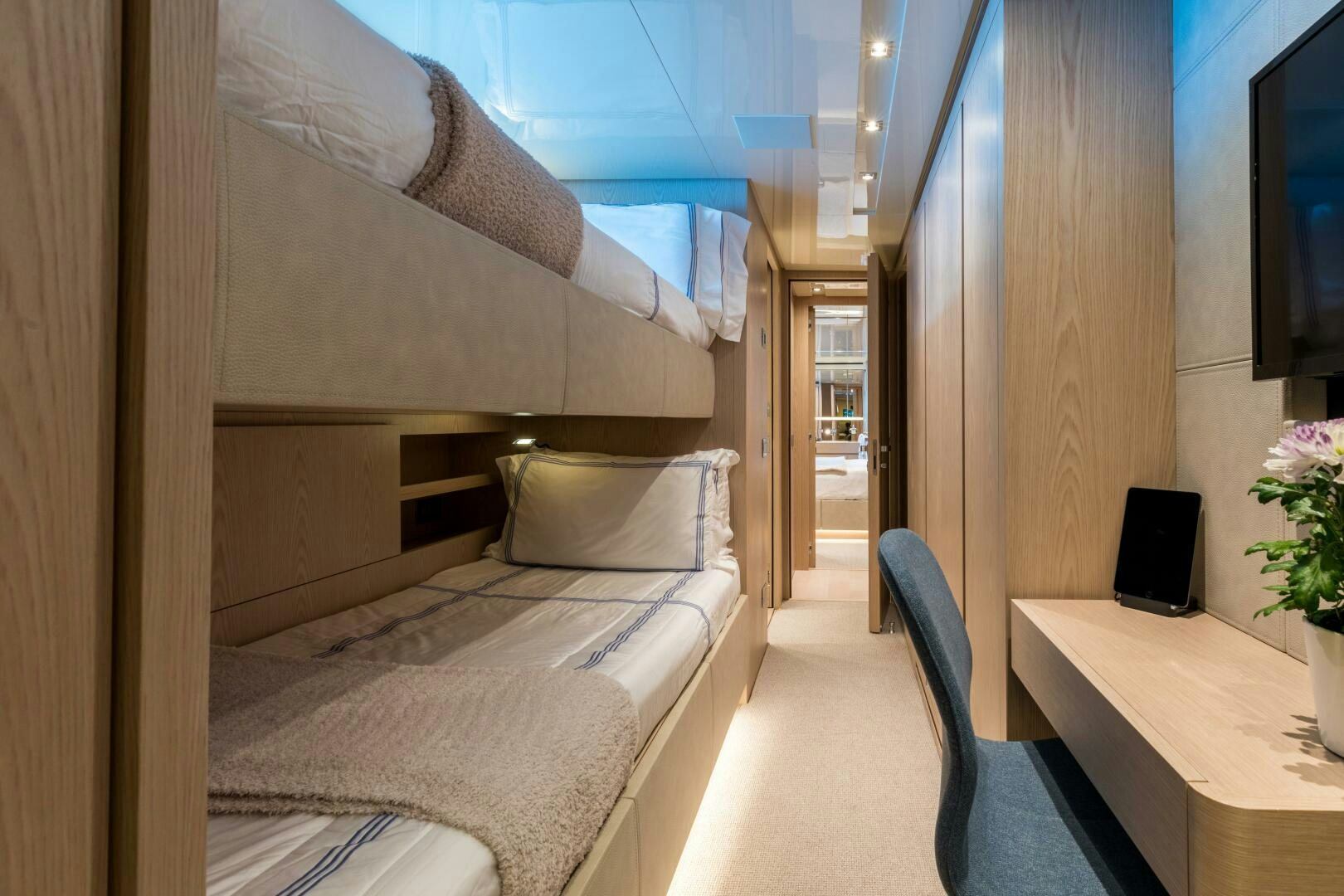 a room with a bed and a desk aboard GLORY Yacht for Sale