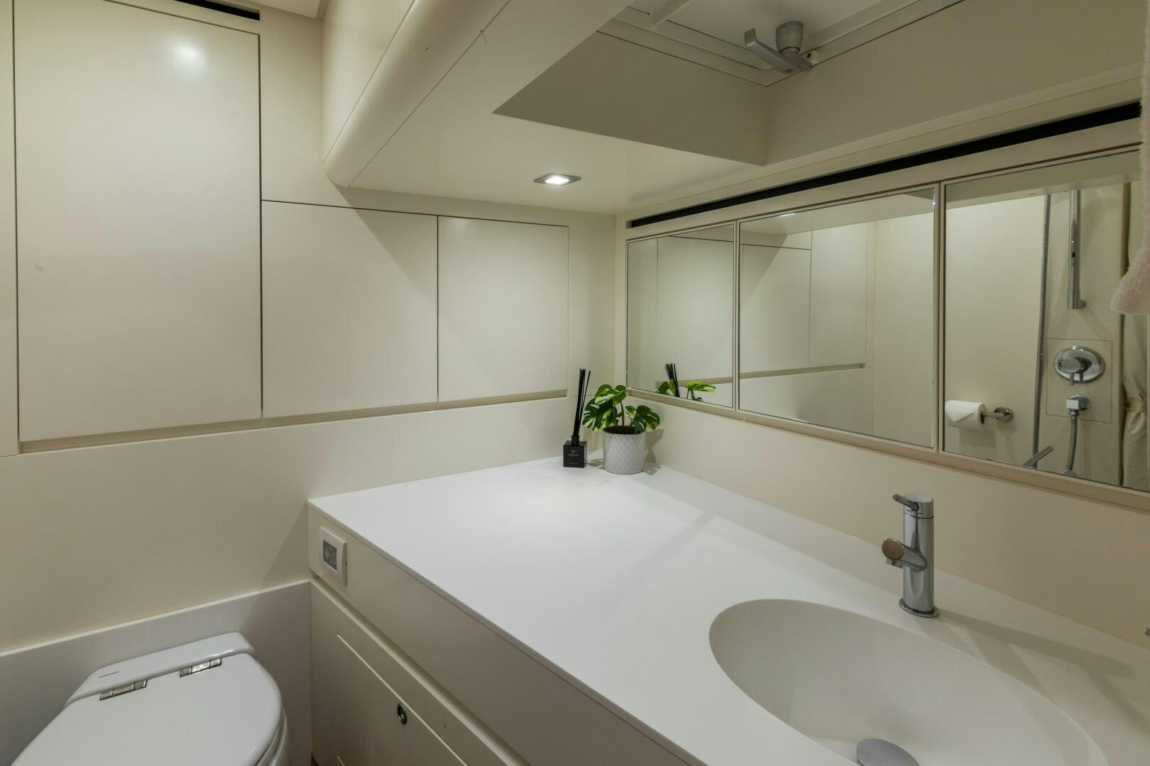 a bathroom with a sink and a mirror aboard GLORY Yacht for Sale