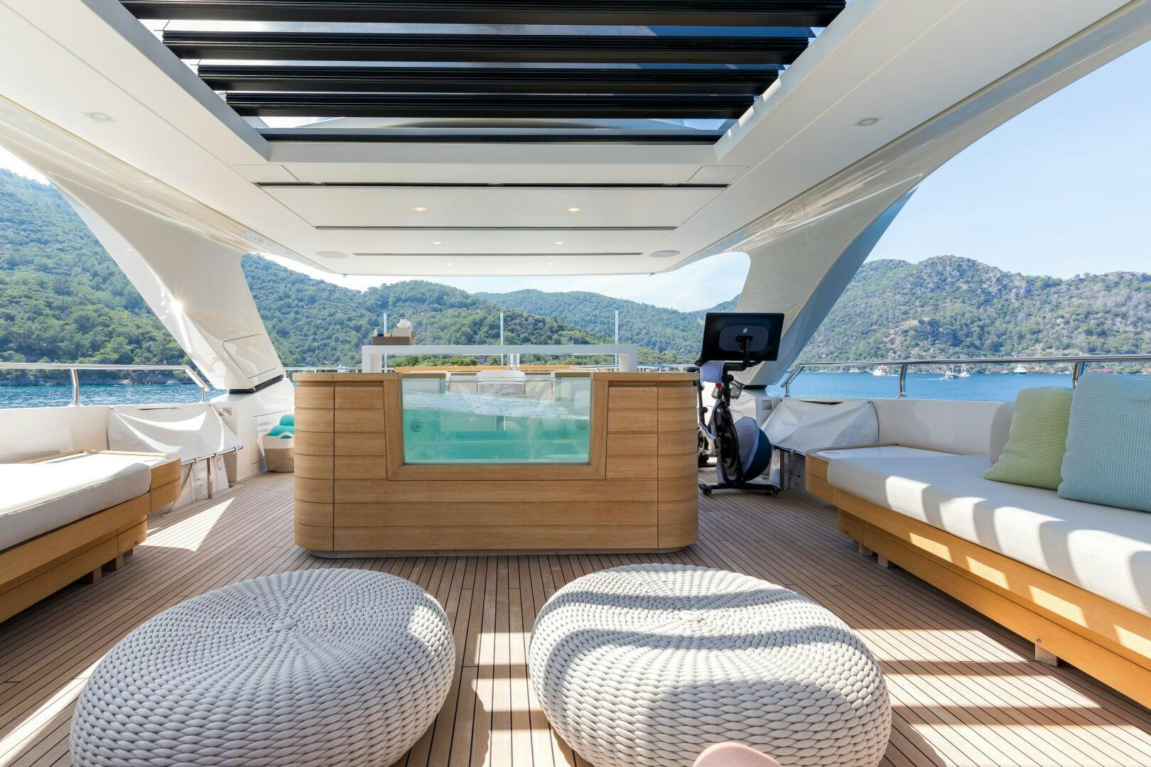 a room with a view of the mountains and the ocean aboard GLORY Yacht for Sale