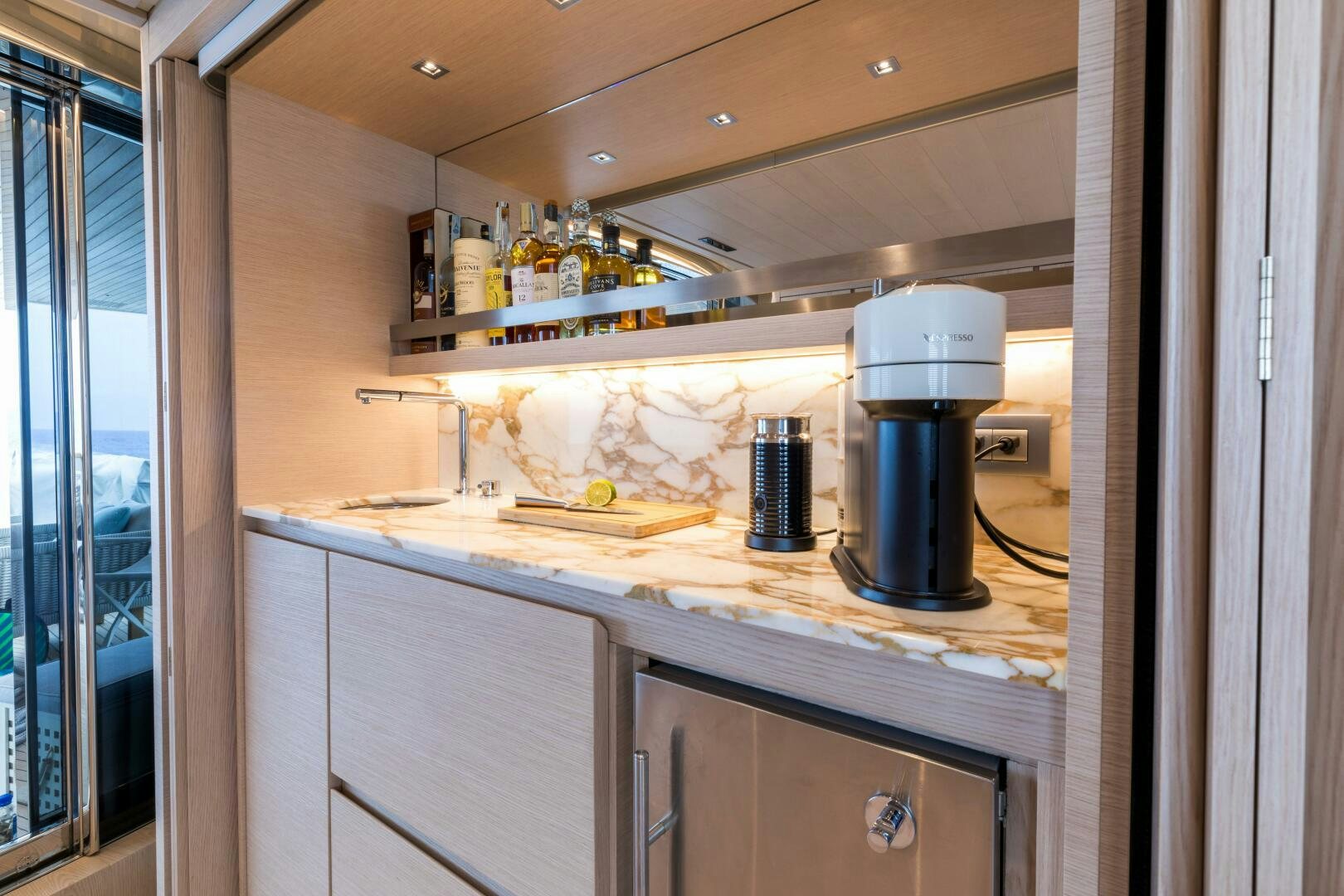 a kitchen with a large black coffee pot on a counter aboard GLORY Yacht for Sale