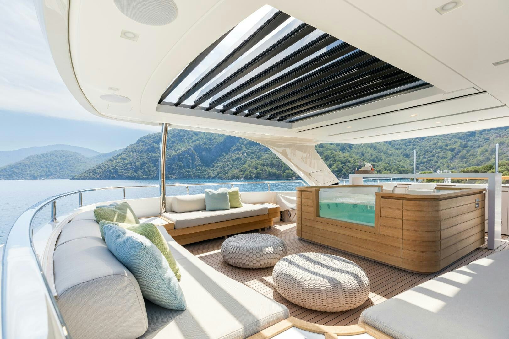 a room with a bed and a bench aboard GLORY Yacht for Sale