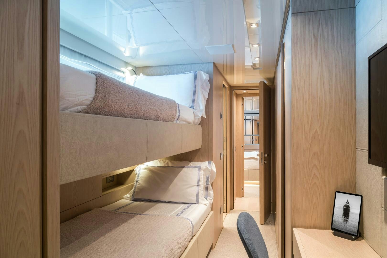 a room with a bed and a television aboard GLORY Yacht for Sale