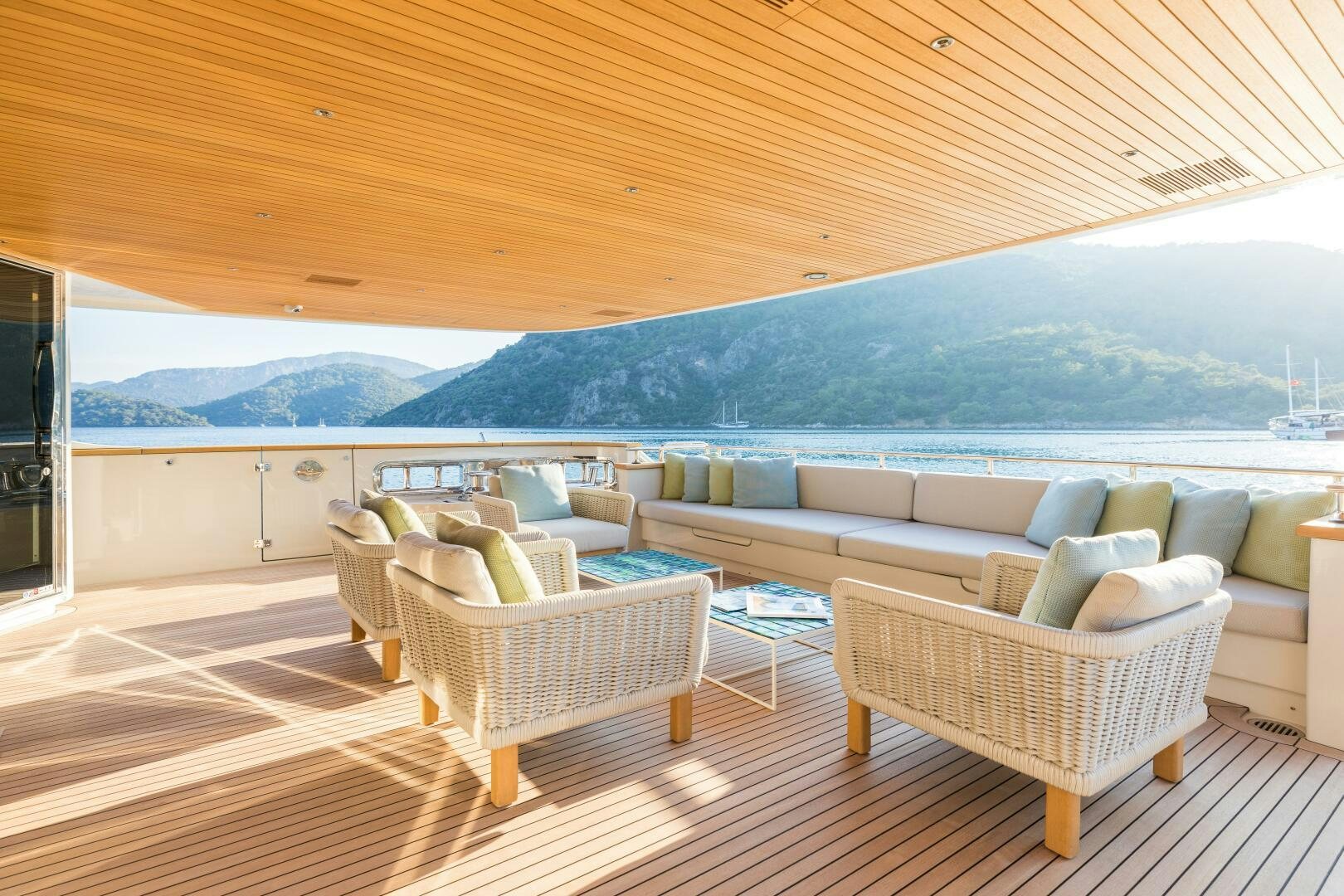 a large living room with a view of the ocean aboard GLORY Yacht for Sale