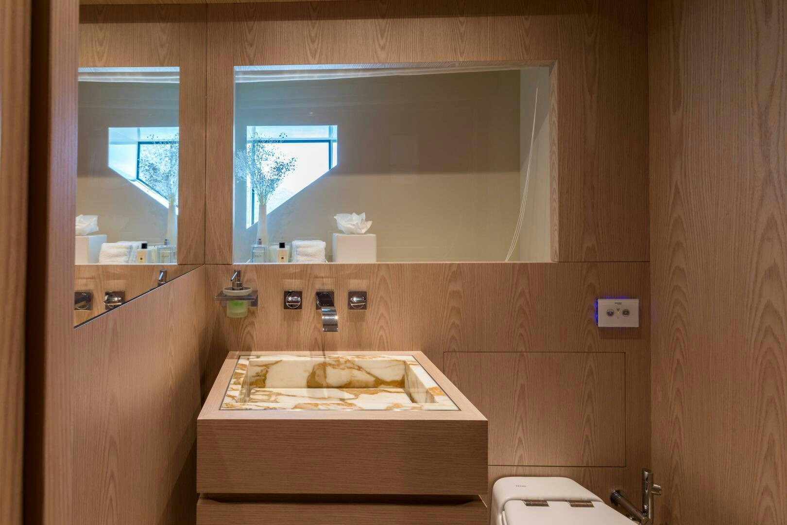 a bathroom with a large mirror aboard GLORY Yacht for Sale