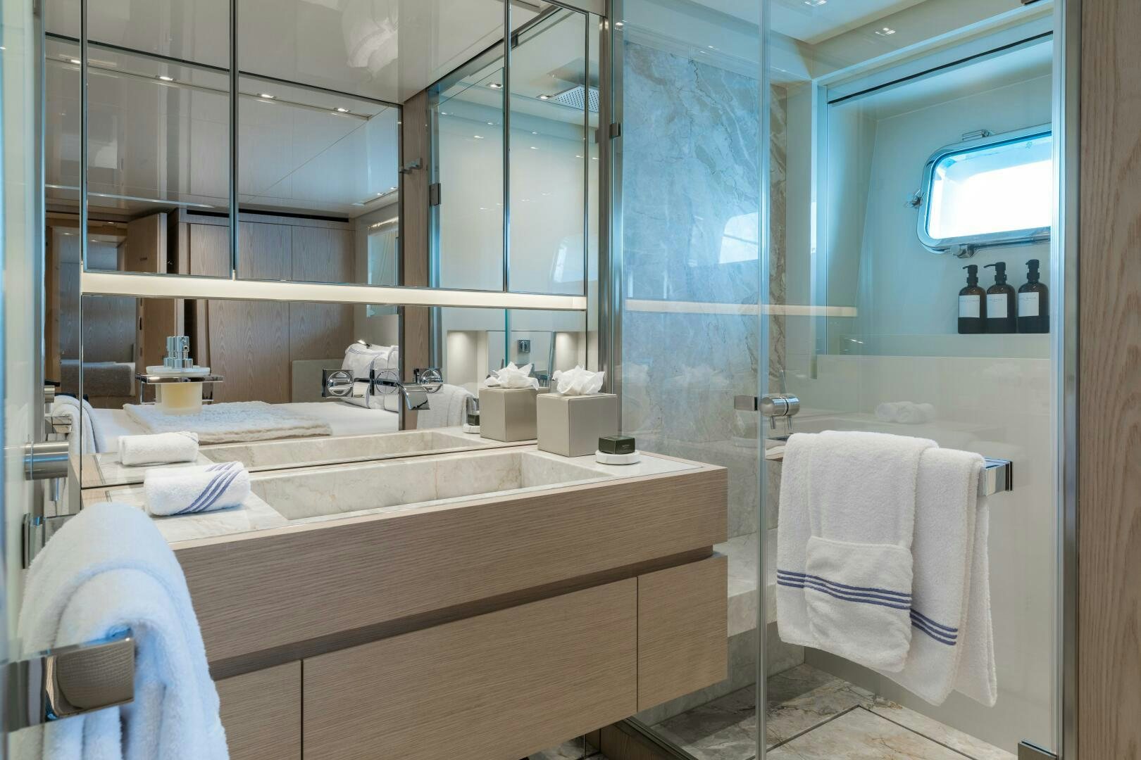 a bathroom with a large mirror aboard GLORY Yacht for Sale
