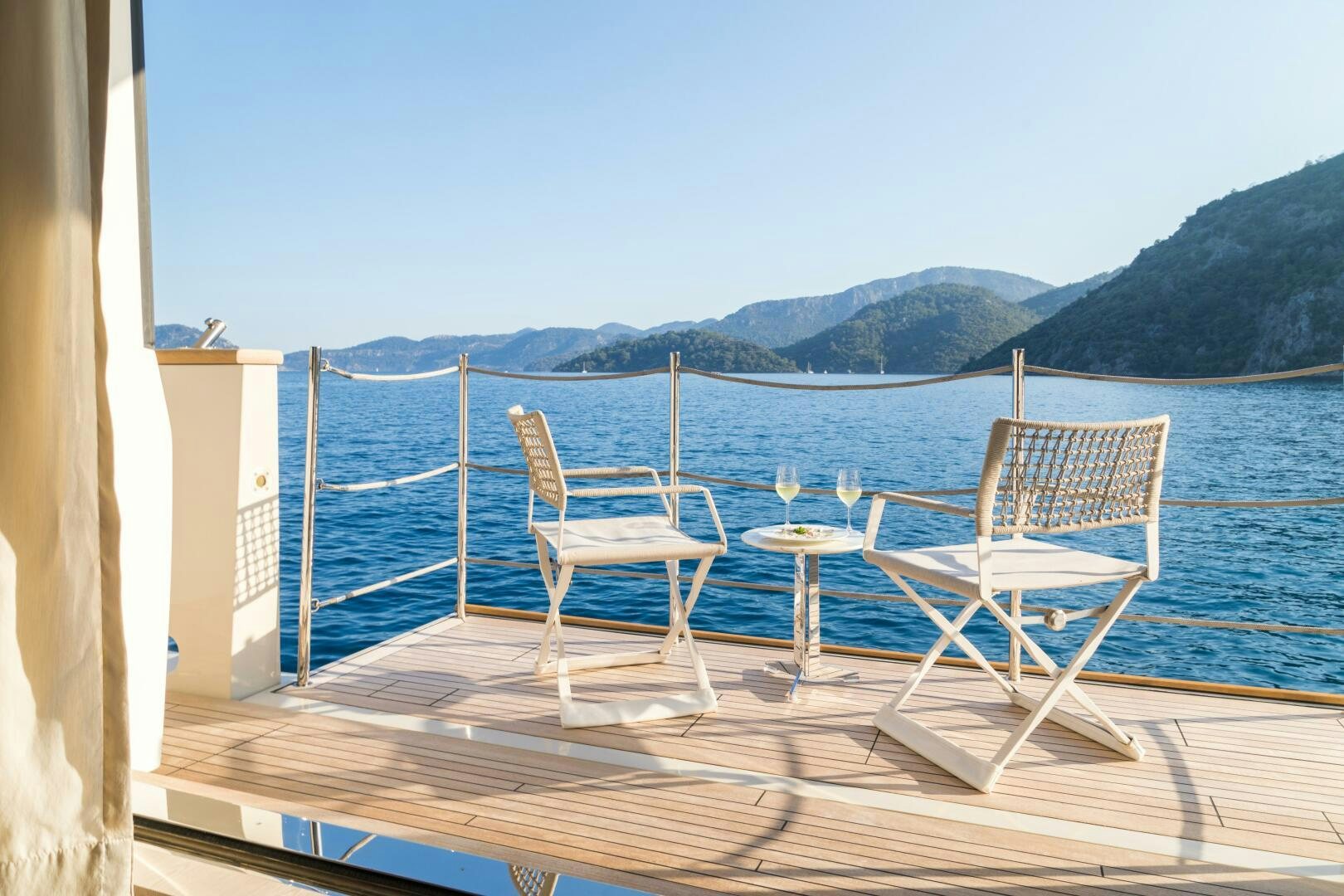 a deck overlooking a body of water aboard GLORY Yacht for Sale
