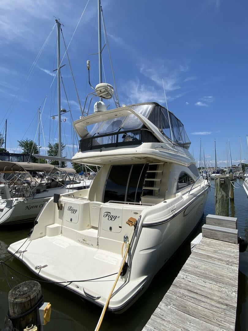 a boat docked at a pier aboard BIGG FIGG II Yacht for Sale