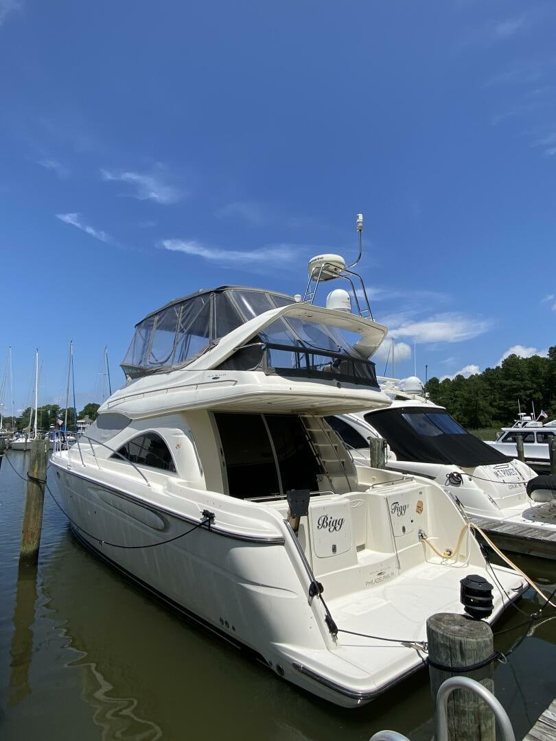 a boat docked at a pier aboard BIGG FIGG II Yacht for Sale