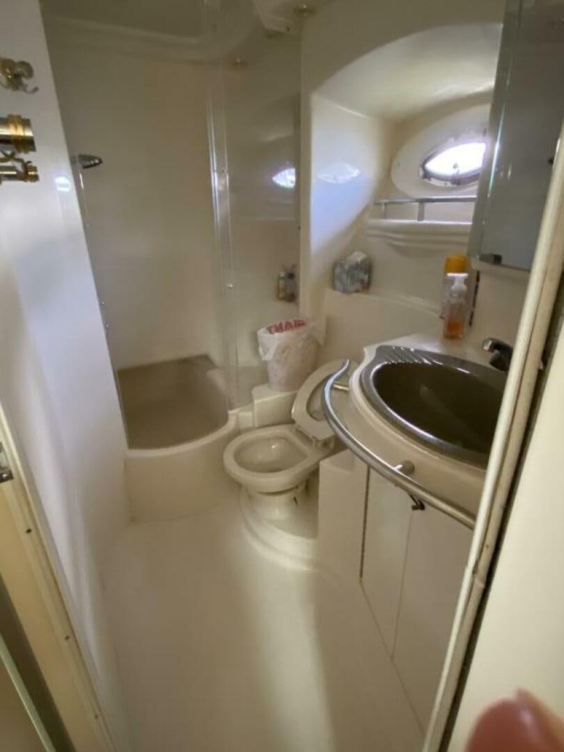 a bathroom with a sink and toilet aboard BIGG FIGG II Yacht for Sale