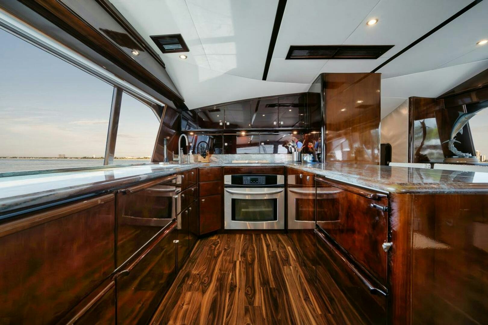 a kitchen with wooden cabinets aboard UNCONQUERED Yacht for Sale