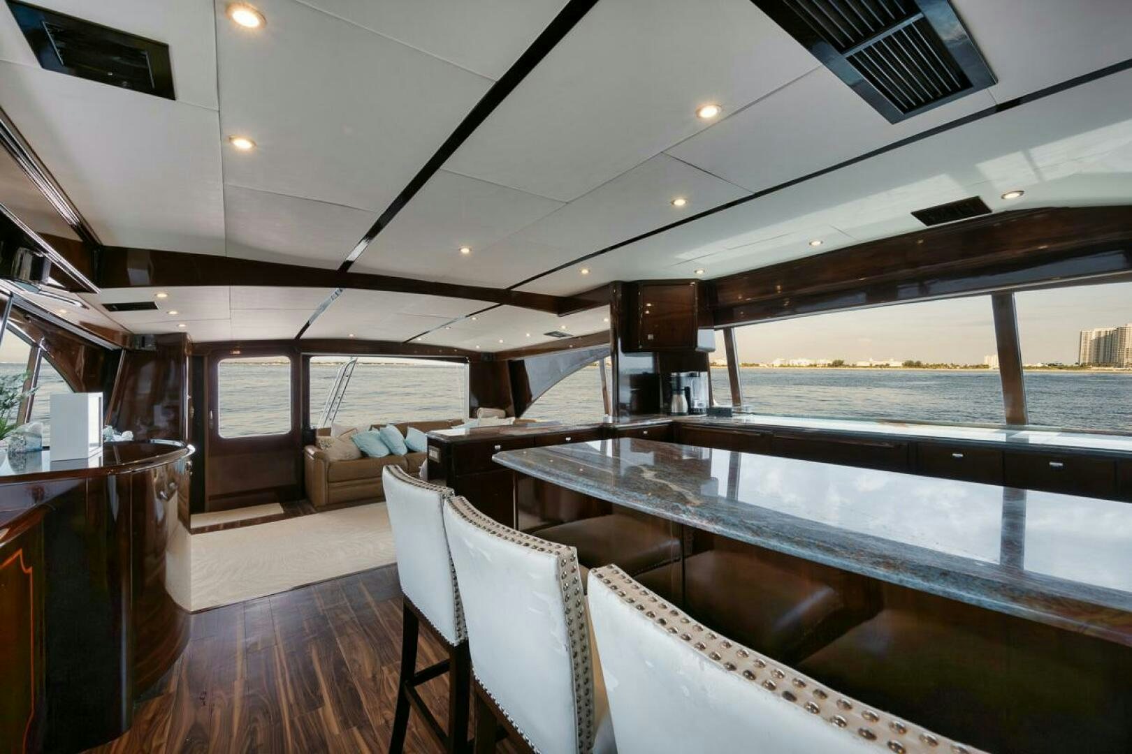 a large room with a large pool aboard UNCONQUERED Yacht for Sale