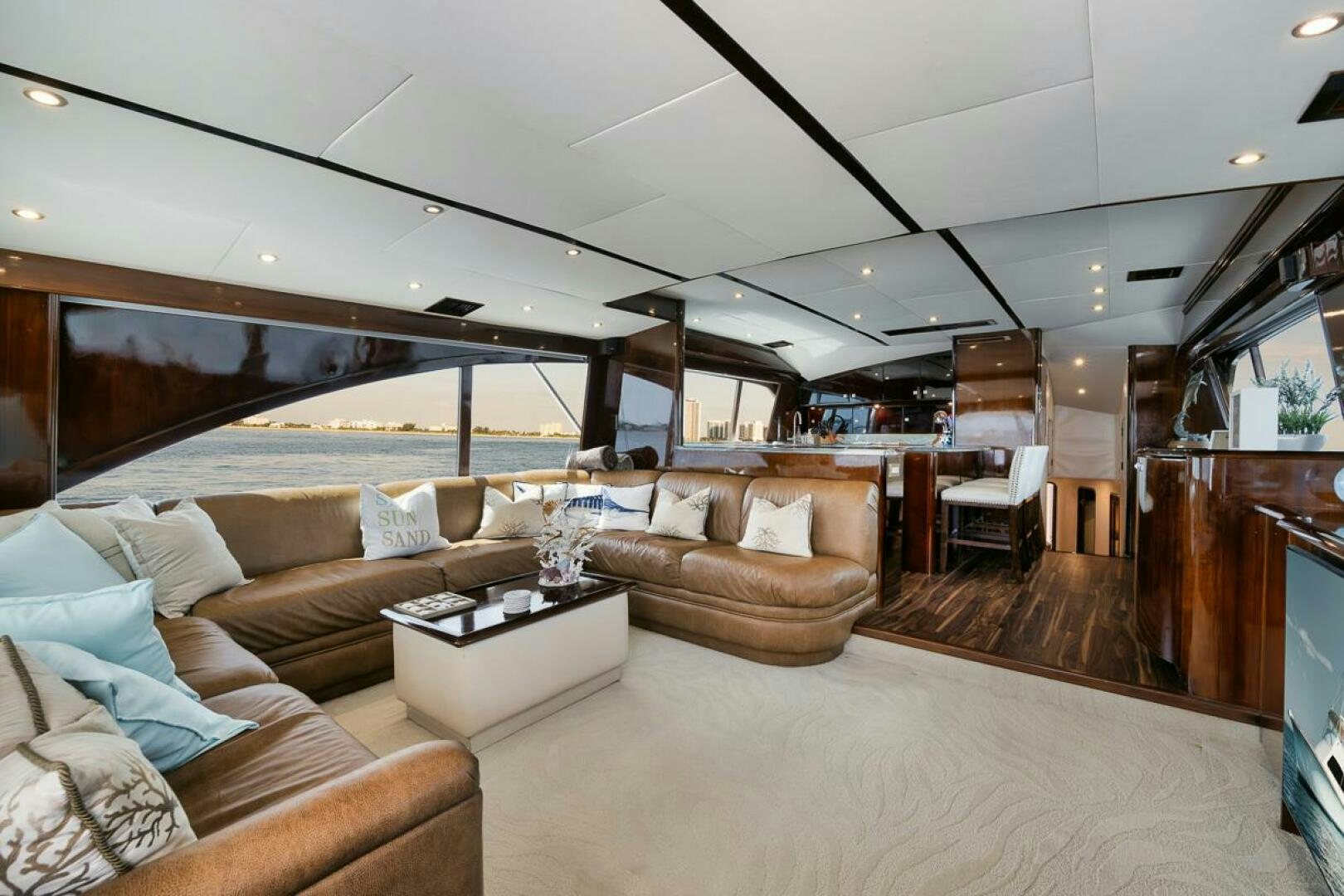 a living room with a large glass window aboard UNCONQUERED Yacht for Sale