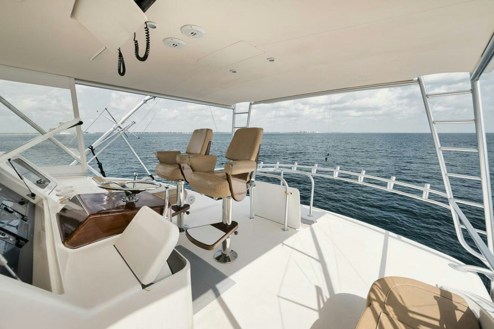 a boat with a chair and a table on it aboard UNCONQUERED Yacht for Sale