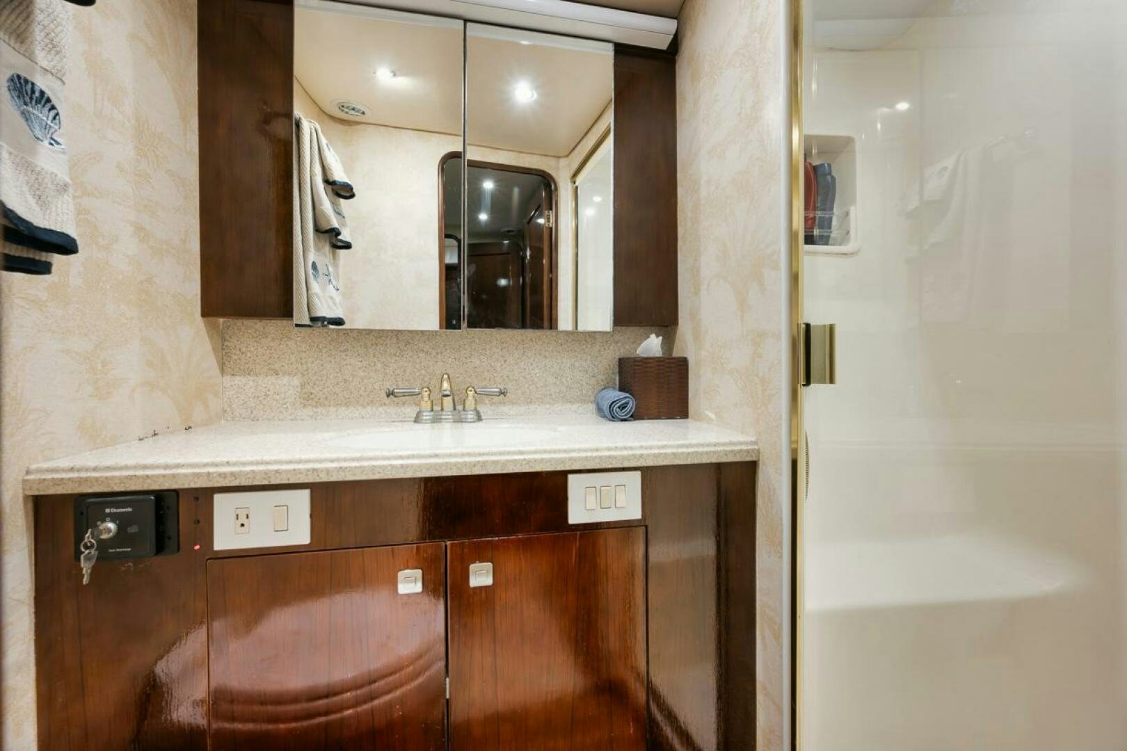 a bathroom with a sink and a mirror aboard UNCONQUERED Yacht for Sale
