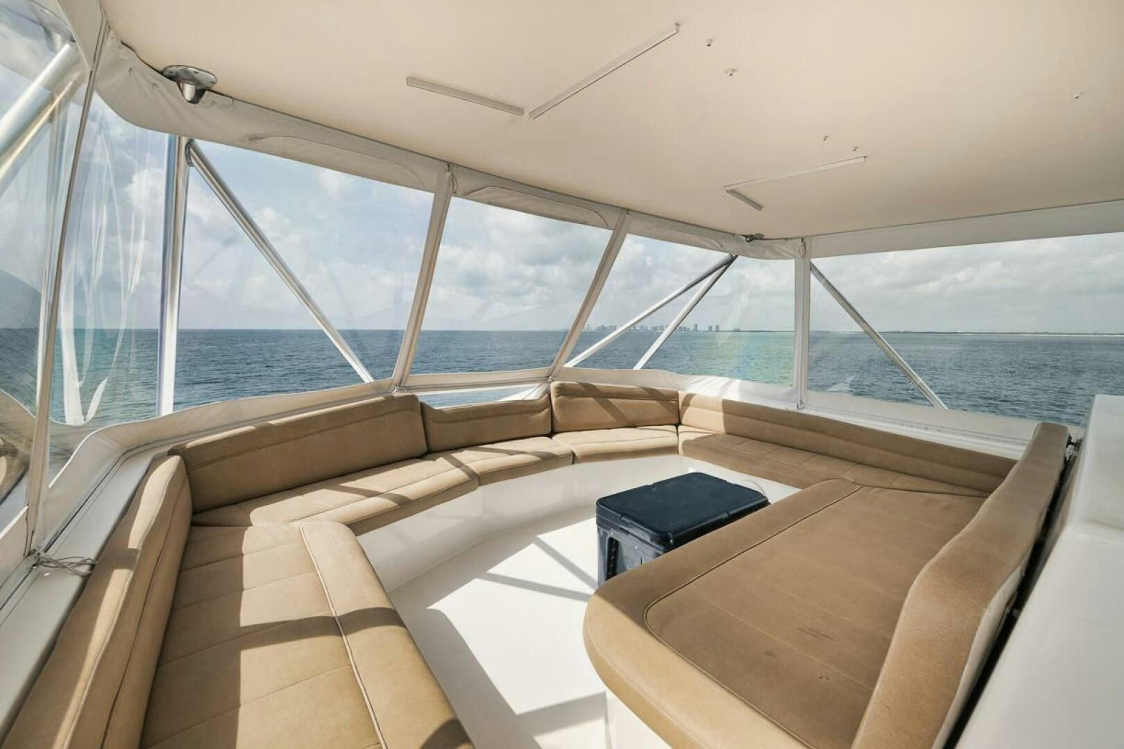 a boat with a laptop on the deck aboard UNCONQUERED Yacht for Sale