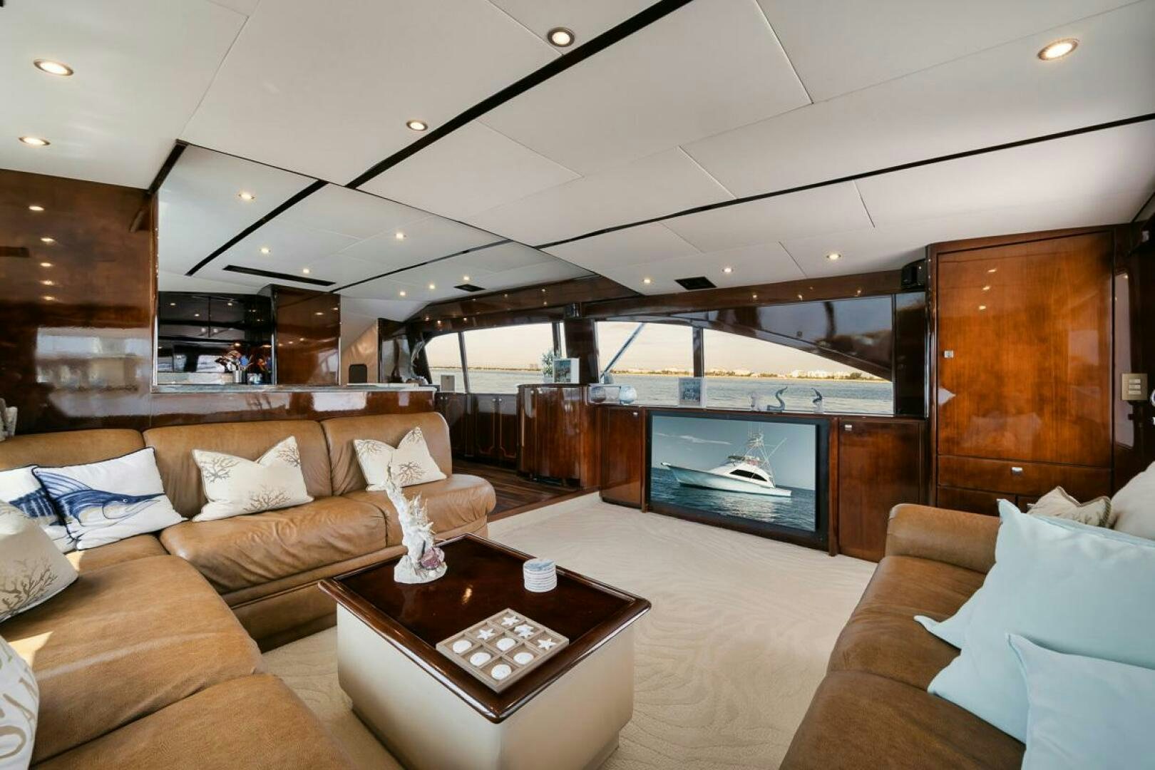 a living room with a fireplace aboard UNCONQUERED Yacht for Sale