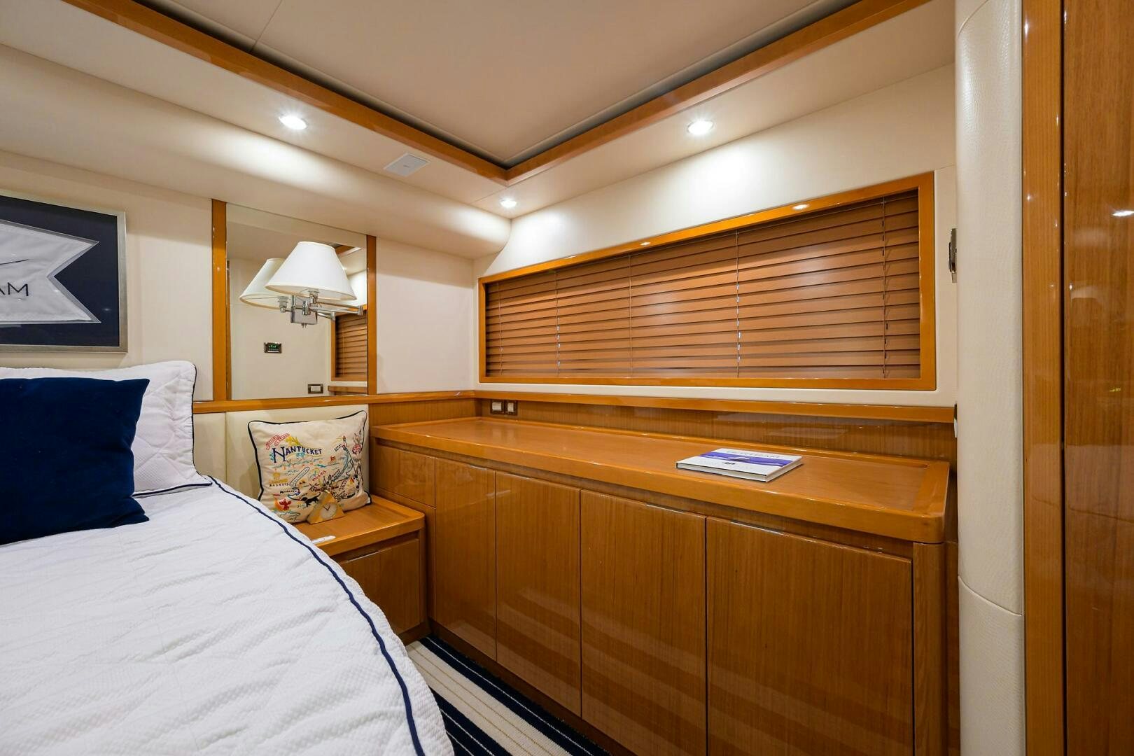 a bedroom with a bed and a desk aboard GOIN DEEP Yacht for Sale