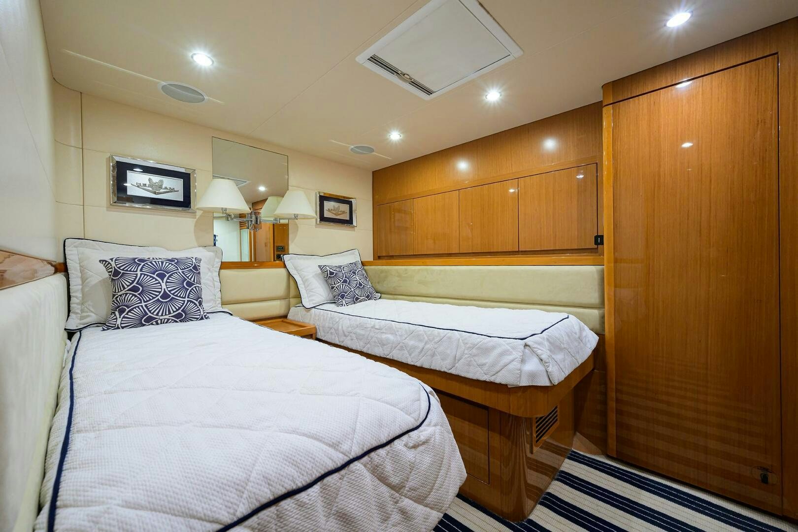 a room with a couple of beds aboard GOIN DEEP Yacht for Sale