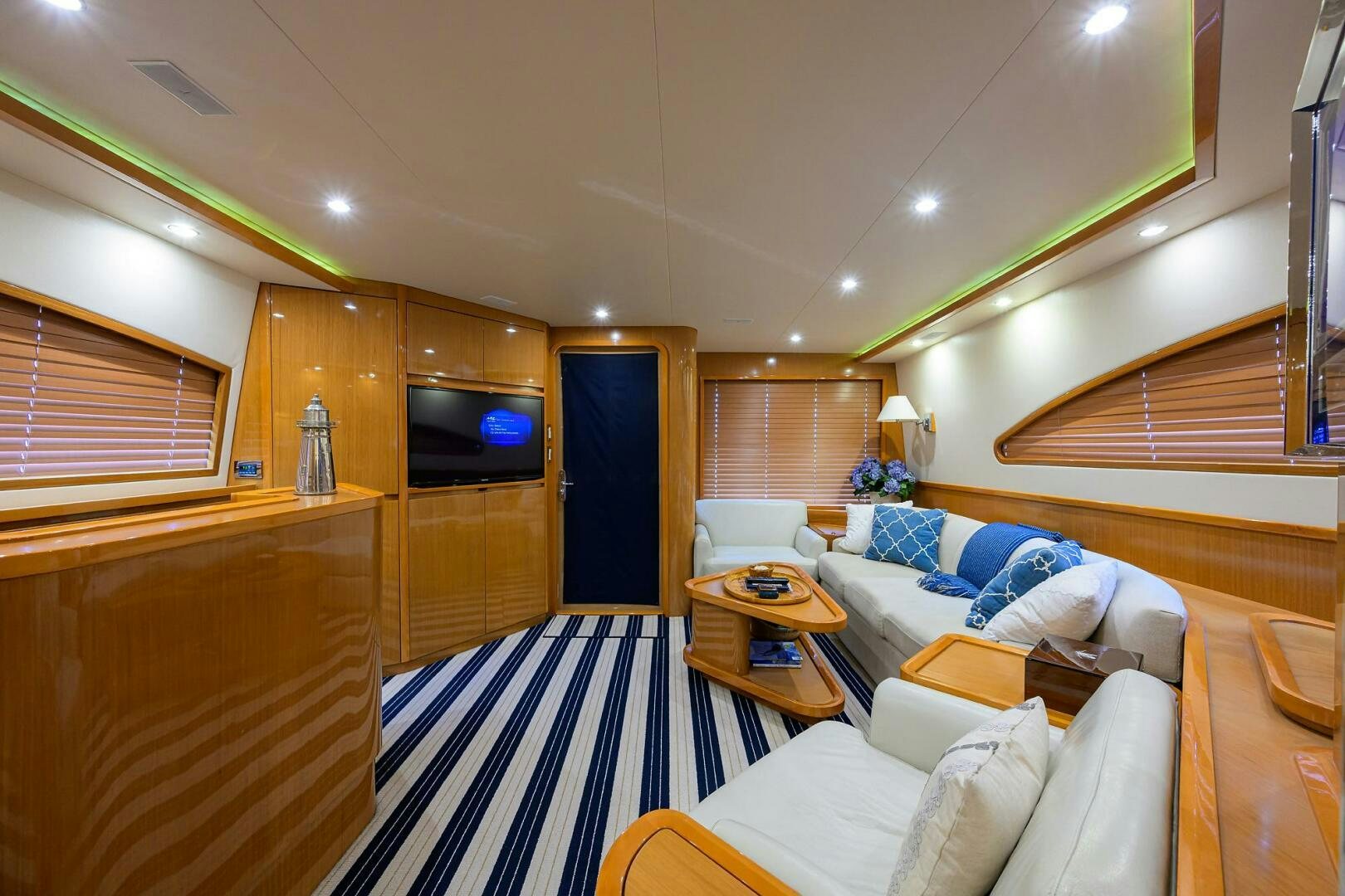a room with a bed and a television aboard GOIN DEEP Yacht for Sale