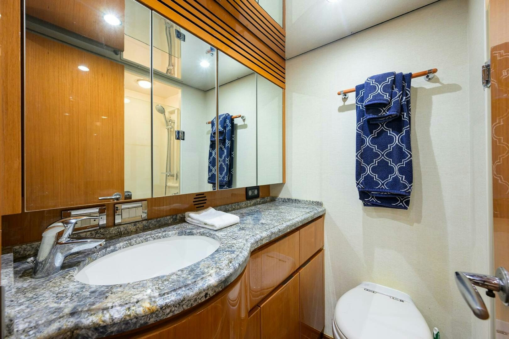 a bathroom with a sink and a mirror aboard GOIN DEEP Yacht for Sale