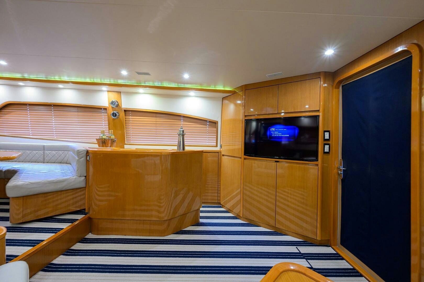 a room with a bed and a tv aboard GOIN DEEP Yacht for Sale