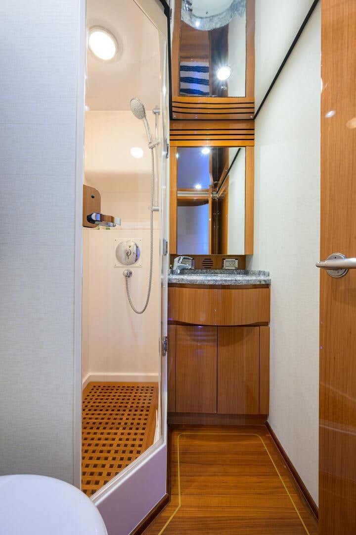 a bathroom with a sink and a mirror aboard GOIN DEEP Yacht for Sale