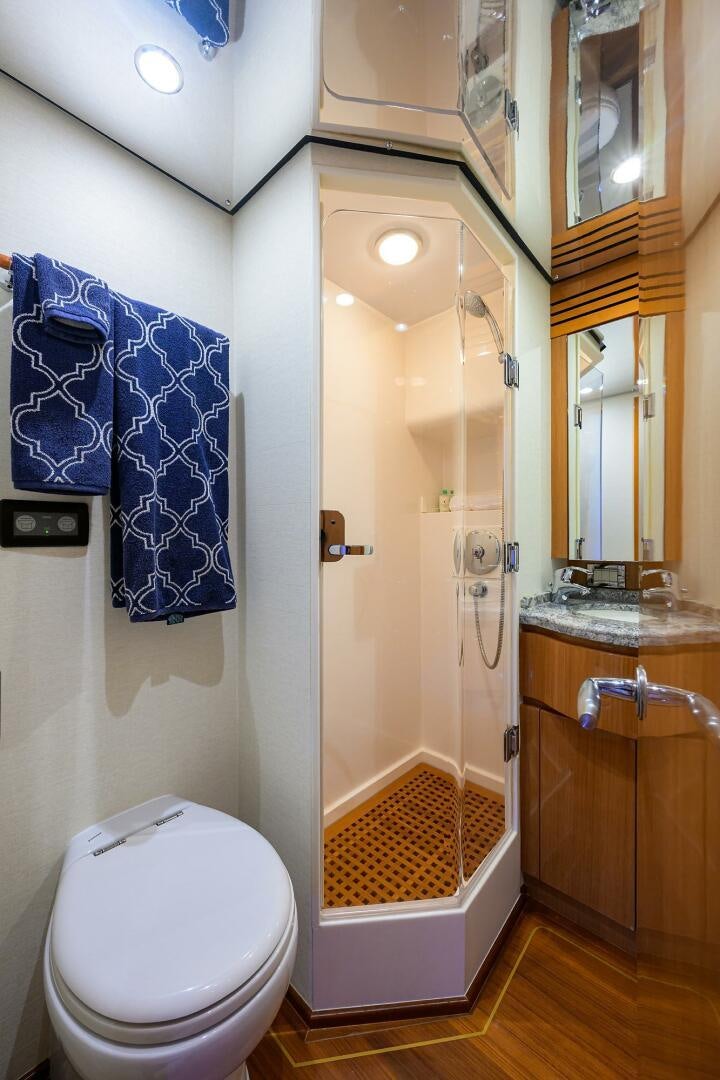 a bathroom with a toilet and a sink aboard GOIN DEEP Yacht for Sale