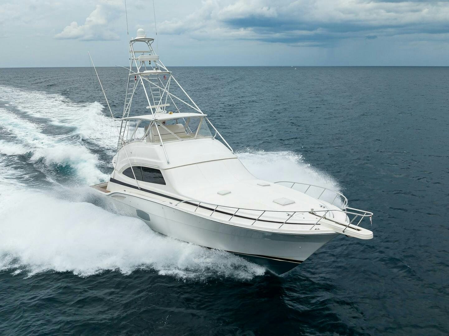 a white boat on the water aboard GOIN DEEP Yacht for Sale