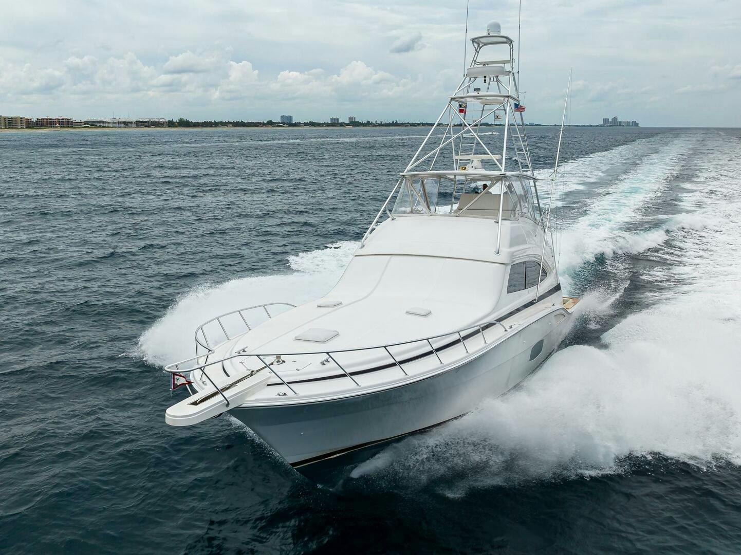 a large white boat on the water aboard GOIN DEEP Yacht for Sale