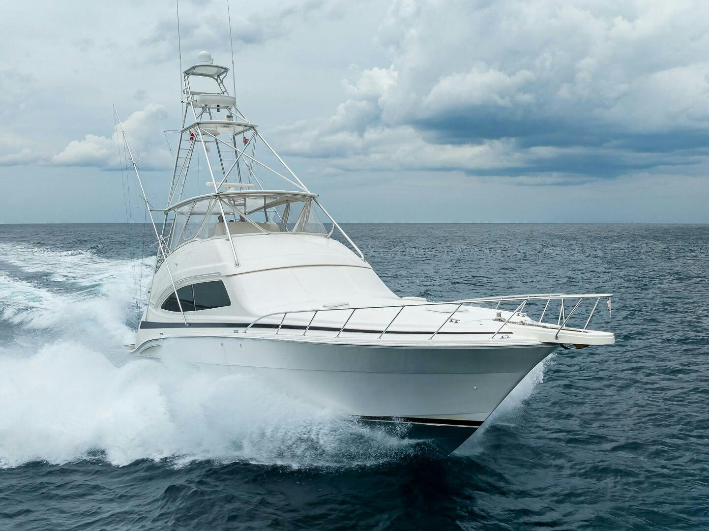 a white boat in the water aboard GOIN DEEP Yacht for Sale