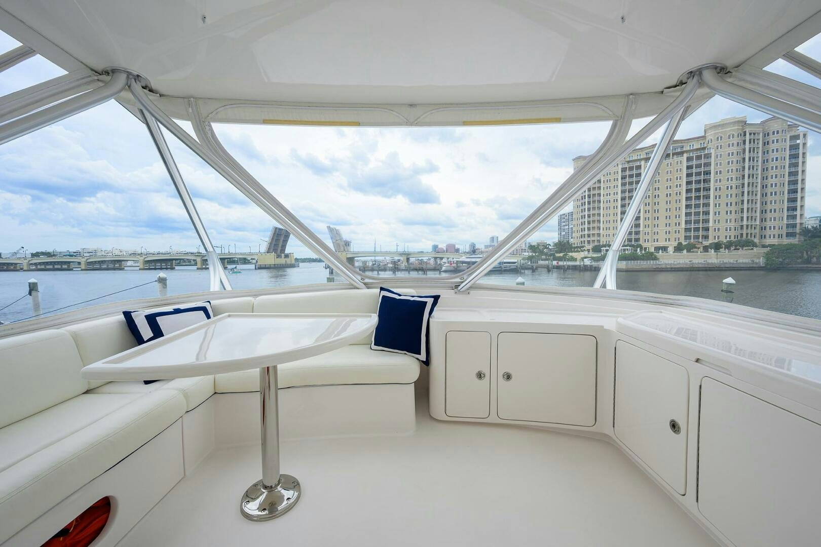 a white boat on a body of water aboard GOIN DEEP Yacht for Sale