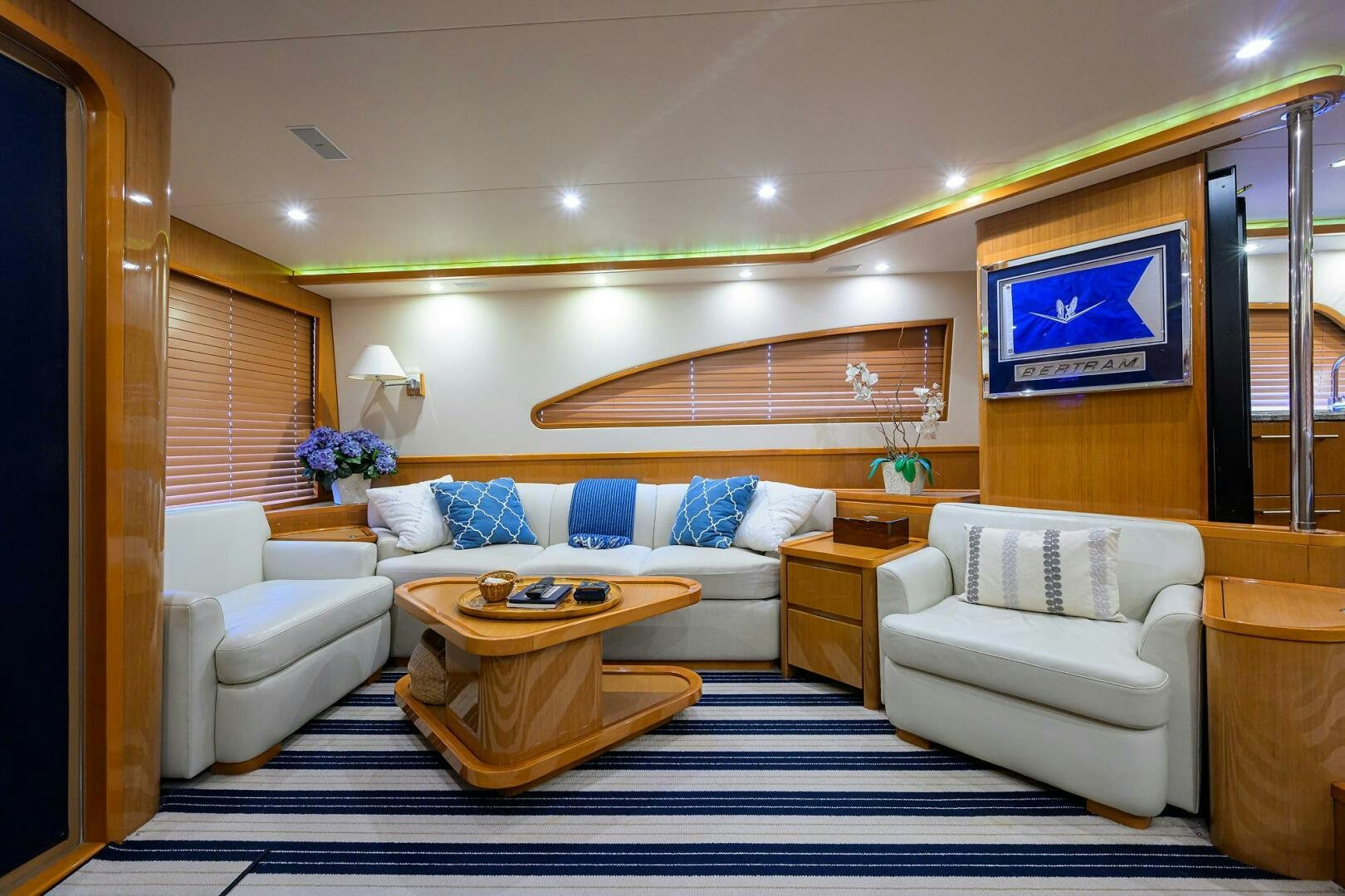 a living room with a couch and a table aboard GOIN DEEP Yacht for Sale