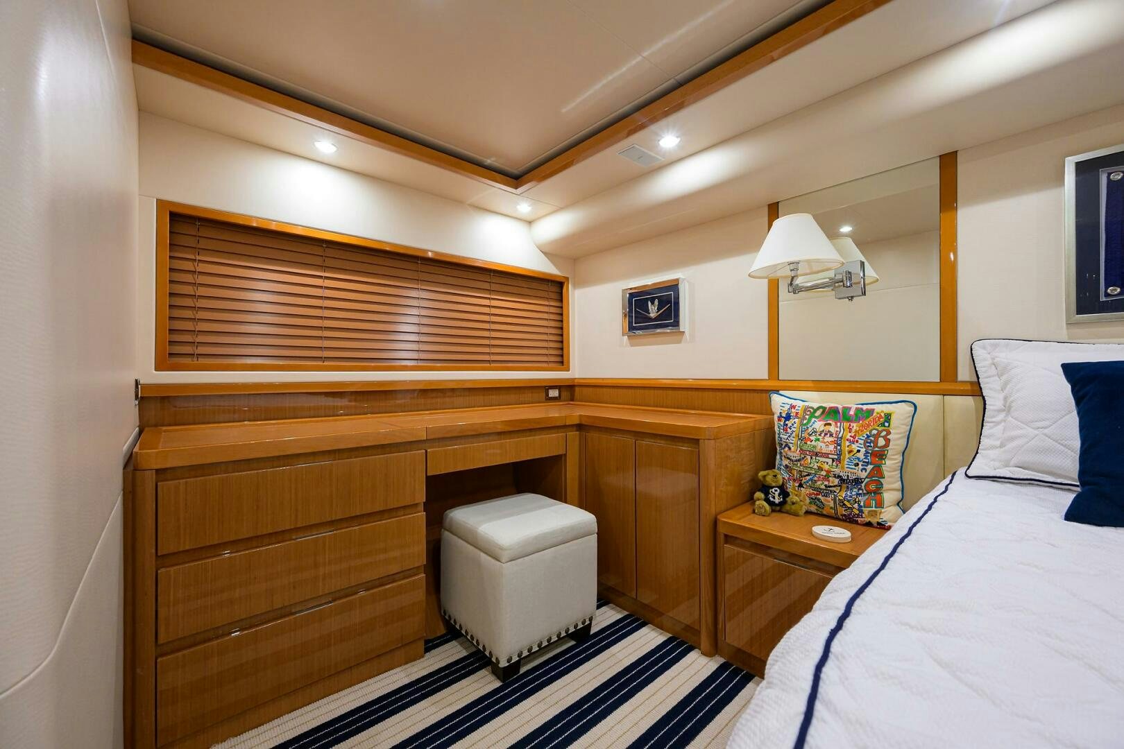 a room with a bed and a desk aboard GOIN DEEP Yacht for Sale