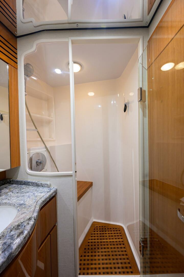 a bathroom with a shower and sink aboard GOIN DEEP Yacht for Sale