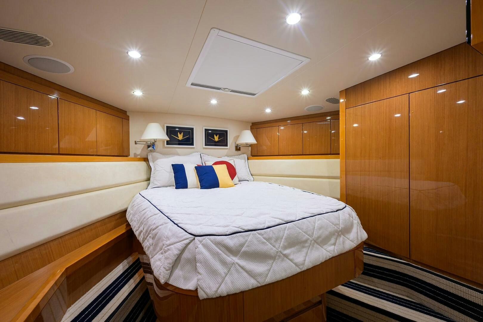 a room with a bed and a wood door aboard GOIN DEEP Yacht for Sale