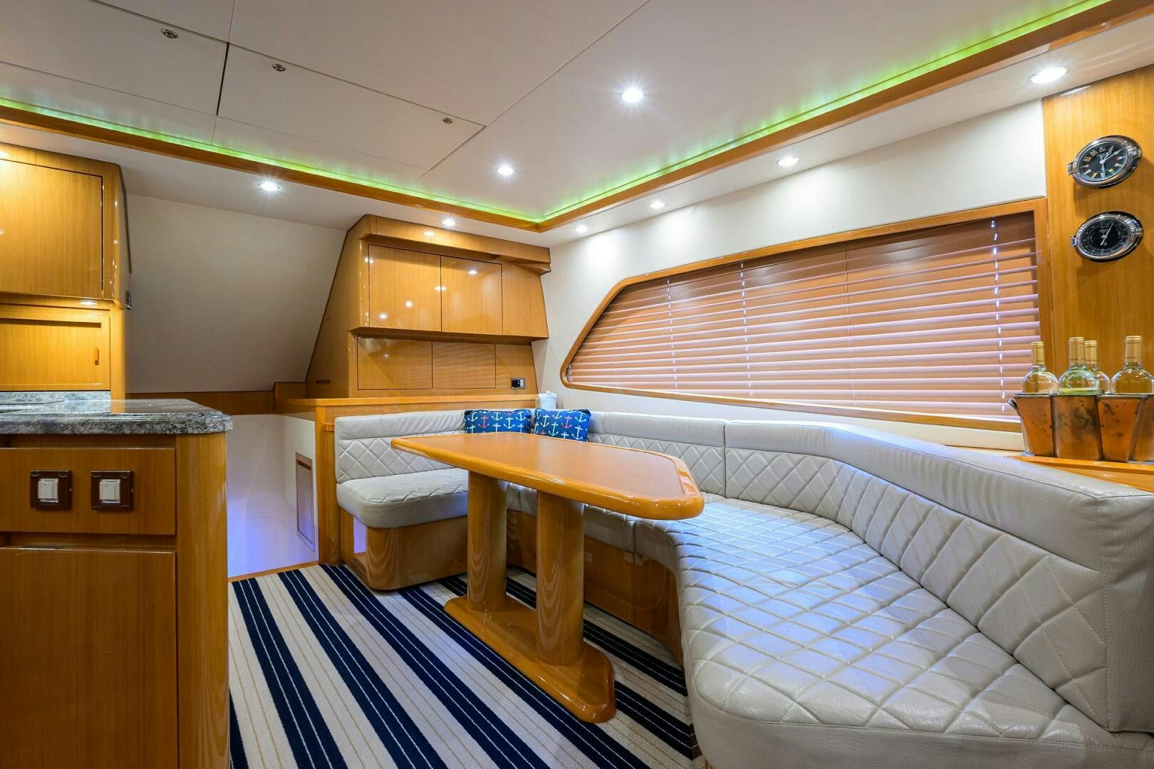 a room with a table and a bed aboard GOIN DEEP Yacht for Sale