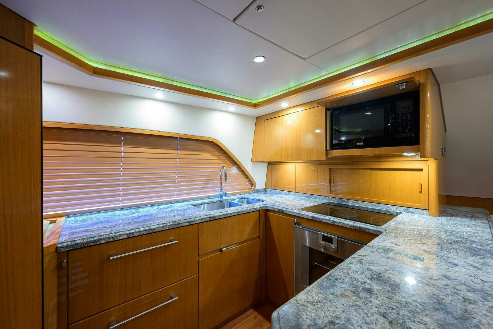 a kitchen with wooden cabinets aboard GOIN DEEP Yacht for Sale