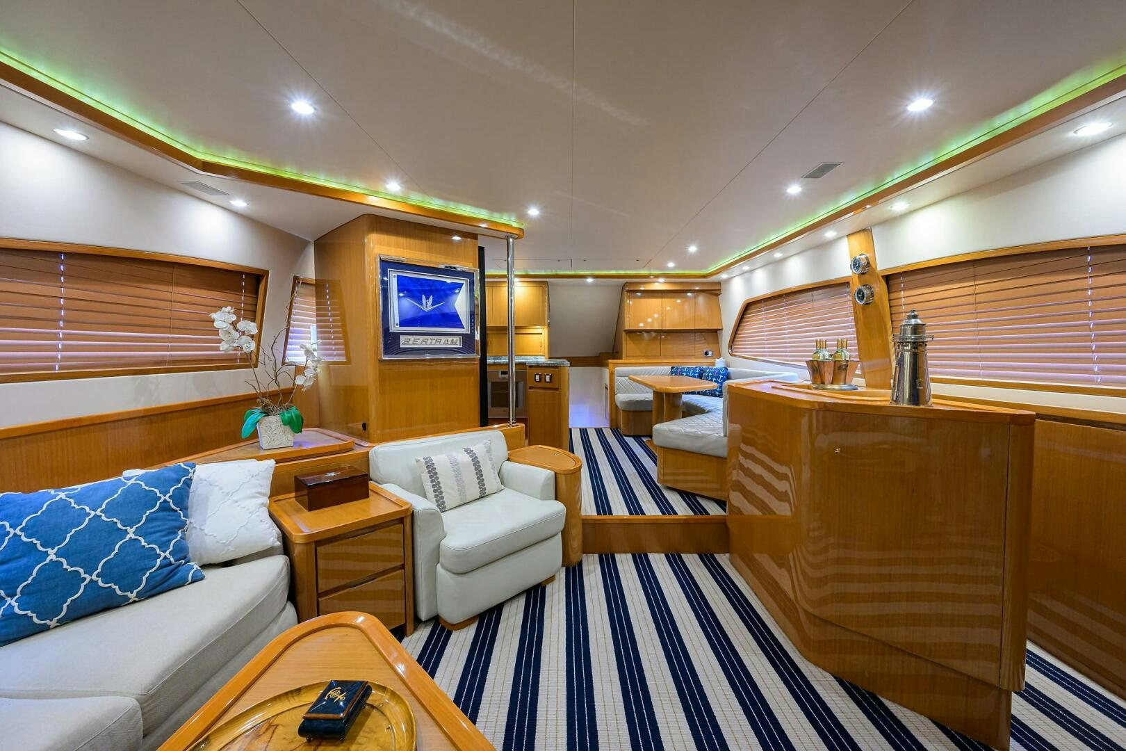 a room with a bed and a table aboard GOIN DEEP Yacht for Sale